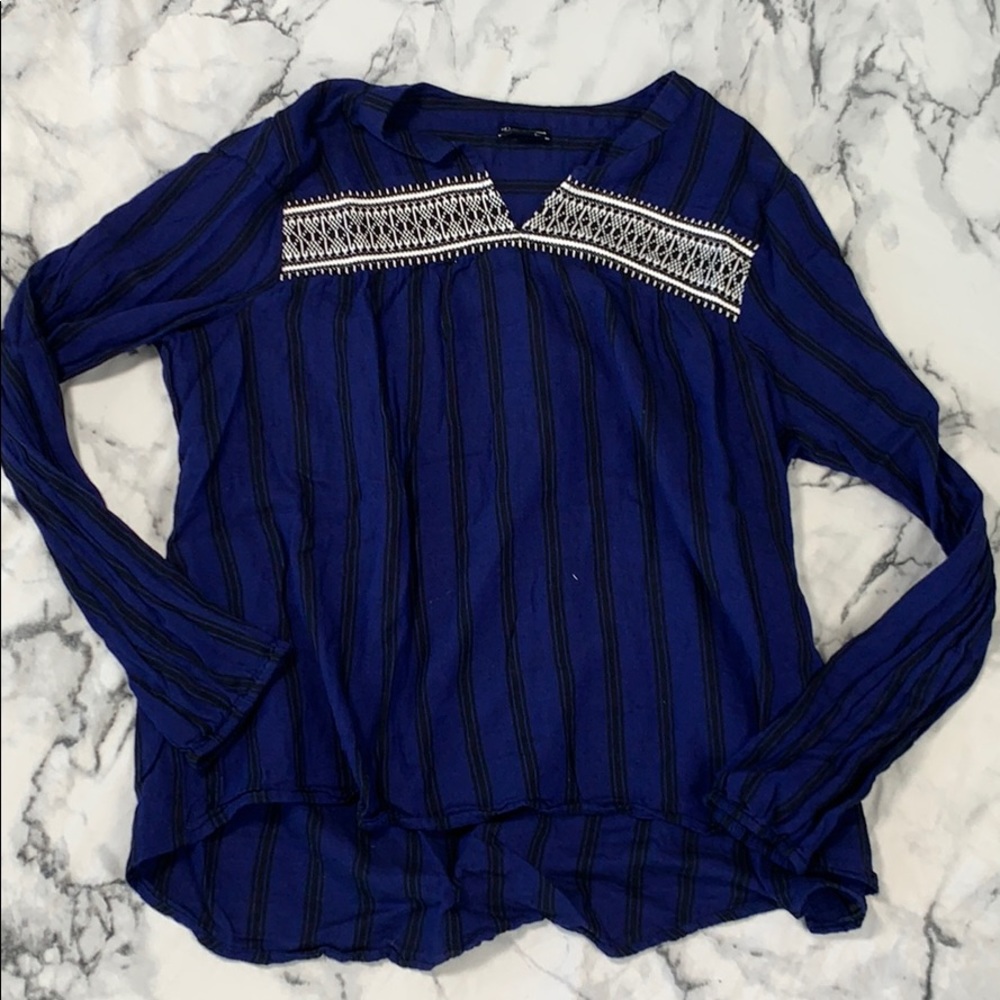 Blue and black striped top with patterned top